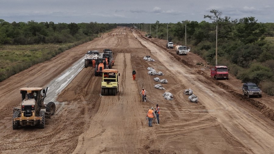 Heavy machinery grading a new road through low Chaco forest